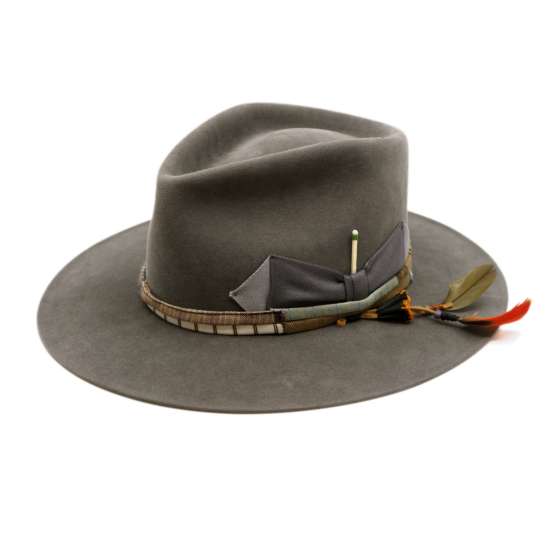 100% felt hat in Slate Grey  Western  Weight   ½” NF multi fabric band and cord   Double tonal grey grosgrain bow  Leather patches and molt harvested parrot feather   Flat brim  Made in USA 